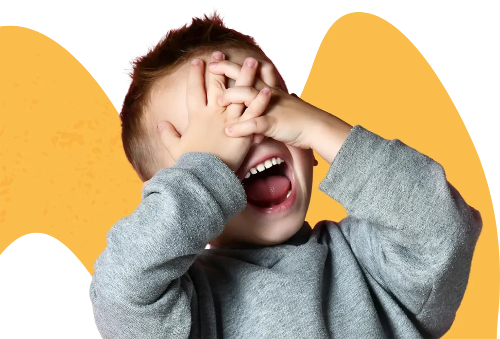Child playing hide and seek at Funky Nursery & Pre-School in Cheltenham