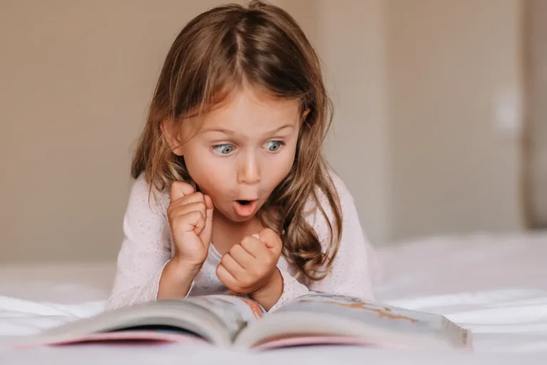 Pre-school child enjoying a picture book at Funky Nursery & Pre-School in Cheltenham